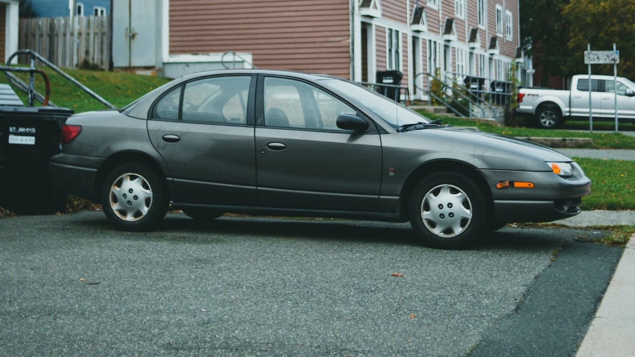 A Black Sedan Parked on the Road | Goodwill Car Donations